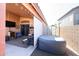 Charming patio with an outdoor television, spa, and cozy seating for relaxing evenings at 14912 W Lamoille Dr, Surprise, AZ 85374