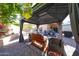 Comfortable outdoor patio under a gazebo provides an idyllic location for entertaining guests at 14912 W Lamoille Dr, Surprise, AZ 85374