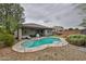 Backyard featuring a pool, and a seating area for outdoor enjoyment at 16140 W Sierra St, Surprise, AZ 85379