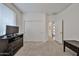 Bedroom featuring carpeted floors, neutral walls, and closet at 16140 W Sierra St, Surprise, AZ 85379