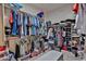 Spacious walk-in closet with clothing racks, shelving, and storage for shoes and folded clothes at 16140 W Sierra St, Surprise, AZ 85379
