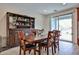 Dining room featuring a hutch, dining table, chairs, and sliding doors to the pool at 16140 W Sierra St, Surprise, AZ 85379