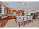 Bright, open kitchen featuring stainless steel appliances, granite counters, and a center island with seating at 16140 W Sierra St, Surprise, AZ 85379