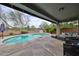 Inviting outdoor pool and patio area perfect for relaxation and entertainment at 16140 W Sierra St, Surprise, AZ 85379