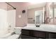 Well-lit bathroom featuring a shower-tub combo and a vanity with a large mirror at 1905 E Palomino Dr, Gilbert, AZ 85296