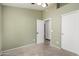 Bedroom with neutral carpet, closet, and a door leading to another room at 1905 E Palomino Dr, Gilbert, AZ 85296