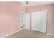 Bedroom with neutral carpet, closet, and a door leading to another room at 1905 E Palomino Dr, Gilbert, AZ 85296