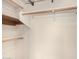 Walk-in closet with multiple shelves and hanging rods for ample storage at 1905 E Palomino Dr, Gilbert, AZ 85296