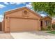 Home featuring a two-car garage, concrete driveway, and desert landscaping at 1905 E Palomino Dr, Gilbert, AZ 85296