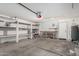 Spacious garage with ample storage and a workbench, perfect for projects at 1905 E Palomino Dr, Gilbert, AZ 85296
