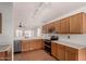 Bright kitchen features wood cabinets, modern appliances, and plenty of counter space at 1905 E Palomino Dr, Gilbert, AZ 85296