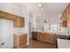 Well-lit kitchen with wood cabinets, updated appliances, and bright countertops for a modern touch at 1905 E Palomino Dr, Gilbert, AZ 85296