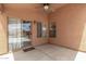 Inviting covered patio with a ceiling fan and sliding glass door leading to the interior at 1905 E Palomino Dr, Gilbert, AZ 85296