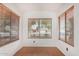 Bright sun room with large windows and blinds, offering great natural light and privacy at 1905 E Palomino Dr, Gilbert, AZ 85296