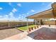 Backyard featuring an artificial lawn, a shed, potted plants, and a covered patio at 19661 N Central Ave, Phoenix, AZ 85024