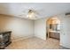 Spacious bedroom with a ceiling fan, tile floors, and a connected bathroom at 19661 N Central Ave, Phoenix, AZ 85024