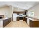 Well-lit kitchen with granite counters, white appliances, tiled flooring, and track lighting at 19661 N Central Ave, Phoenix, AZ 85024