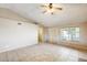 Spacious living room featuring tile floors and a ceiling fan at 19661 N Central Ave, Phoenix, AZ 85024