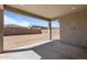 Covered patio offering an empty backyard space with a block wall, ready for personalization at 20209 W San Miguel Ave, Litchfield Park, AZ 85340