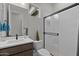 Well-lit bathroom showcasing stylish fixtures, a modern vanity, and a glass-enclosed shower at 20209 W San Miguel Ave, Litchfield Park, AZ 85340