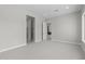 Spacious bedroom with soft carpet and a view into other rooms, offering a bright and airy feel at 20209 W San Miguel Ave, Litchfield Park, AZ 85340