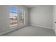 Cozy bedroom with large windows, neutral carpet, offering abundant natural light and serene views at 20209 W San Miguel Ave, Litchfield Park, AZ 85340
