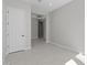 Spacious bedroom with a view to other rooms and gray tile flooring for a modern look at 20209 W San Miguel Ave, Litchfield Park, AZ 85340