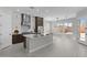 Bright modern kitchen with a central island, stainless steel appliances, and an adjacent dining area at 20209 W San Miguel Ave, Litchfield Park, AZ 85340