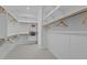 Organized walk-in closet with ample shelving and hanging space offers practical storage solutions at 20209 W San Miguel Ave, Litchfield Park, AZ 85340