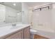 A bathroom featuring a vanity with modern fixtures and a combined tub and shower at 2039 W Ronald Rd, Phoenix, AZ 85029