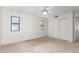 A well-lit bedroom with closet and two windows creates an airy and inviting atmosphere at 2039 W Ronald Rd, Phoenix, AZ 85029