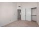 Bedroom boasts ample closet space with sliding doors and a standard door leading to another room at 2039 W Ronald Rd, Phoenix, AZ 85029