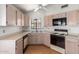 Kitchen featuring linoleum floors, white cabinets, and black appliances at 2039 W Ronald Rd, Phoenix, AZ 85029