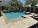 Beautiful backyard pool featuring fountains, a stone water feature and ample space for relaxing by the water at 2087 N Park St, Buckeye, AZ 85396
