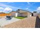 Fully fenced backyard with gravel, an outdoor seating area, and artificial turf at 2726 E Fairmount Ave, Phoenix, AZ 85016
