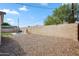 Spacious backyard with gravel, a block fence, and a patio area at 2726 E Fairmount Ave, Phoenix, AZ 85016
