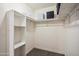 Spacious walk-in closet with plenty of shelving and built-in storage at 2726 E Fairmount Ave, Phoenix, AZ 85016