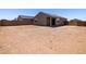 Spacious backyard with desert landscaping, ideal for creating your outdoor oasis at 322 S San Christo Ln, Casa Grande, AZ 85194