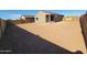 Expansive backyard, ready for landscaping, with ample space for outdoor living and entertaining at 322 S San Christo Ln, Casa Grande, AZ 85194