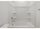 Clean bathroom highlighting bathtub with shower at 322 S San Christo Ln, Casa Grande, AZ 85194