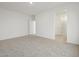 Bright bedroom showing an ensuite bathroom and a closet or dressing room at 322 S San Christo Ln, Casa Grande, AZ 85194