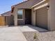Inviting single-story home with a driveway leading to an attached garage and covered entryway at 322 S San Christo Ln, Casa Grande, AZ 85194