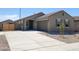 Charming single-story home featuring a low-maintenance desert landscape and neutral color palette at 322 S San Christo Ln, Casa Grande, AZ 85194