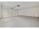 Clean two-car garage with white walls and garage door, offering ample parking space at 322 S San Christo Ln, Casa Grande, AZ 85194