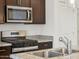 Close-up shot of the kitchen with stainless steel appliances and granite countertops at 322 S San Christo Ln, Casa Grande, AZ 85194