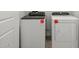 Modern laundry room with new washer and dryer units at 322 S San Christo Ln, Casa Grande, AZ 85194