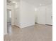 Neutral-toned tiled room with white walls, recessed lighting, and various doorways leading to other rooms at 322 S San Christo Ln, Casa Grande, AZ 85194