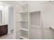Bright walk-in closet with white shelving and a clothing rod, offering ample storage space at 322 S San Christo Ln, Casa Grande, AZ 85194