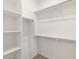Organized walk-in closet with shelving and rod, providing ample storage space at 322 S San Christo Ln, Casa Grande, AZ 85194