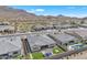 Aerial view of a desert neighborhood with homes that feature manicured backyards and swimming pools at 3466 E Hazeltine Way, Queen Creek, AZ 85142